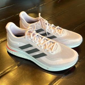 NEW. Light pink adidas. Size 9.